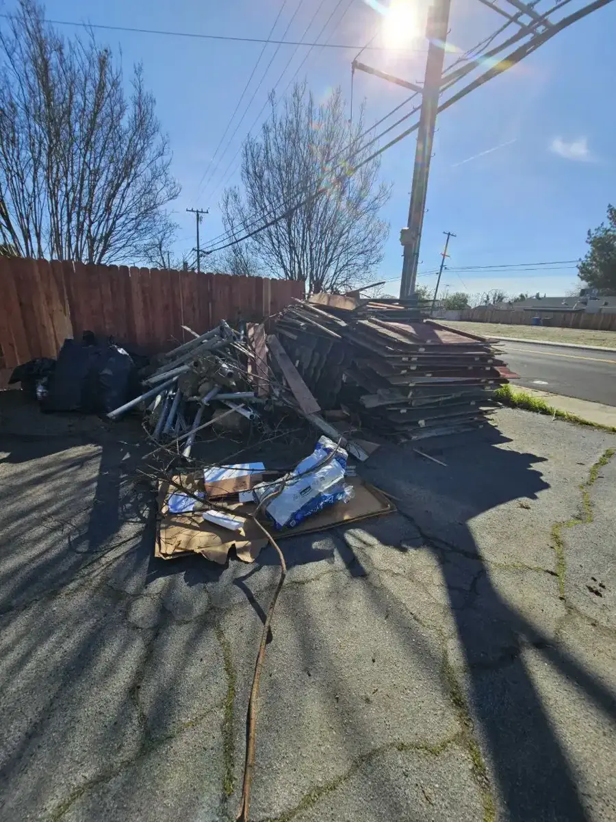 Before project photo 2 showing old fence tear-out & construction debris removal in Turlock, CA